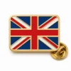 Classic flag Union Jack pin with raised gold metal outlines, red white and blue enamel flag bands, rounded rectangle shape, and a butterfly clutch on white.