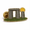 Minimal Stonehenge Arch Pin soft enamel pin with raised metal outlines, flat enamel color sections, connected badge details, and a butterfly clutch on a white background.