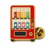 Red Retro Vending Machine Pin soft enamel pin with raised metal outlines, flat enamel color sections, connected badge details, and a butterfly clutch on a white background.