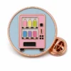 Round Vending Machine Pin soft enamel pin with raised metal outlines, flat enamel color sections, connected badge details, and a butterfly clutch on a white background.