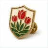 Shield Red Tulip Pin soft enamel pin with raised metal outlines, flat enamel color sections, connected badge details, and a butterfly clutch on a white background.