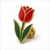 Single Red Tulip Pin soft enamel pin with raised metal outlines, flat enamel color sections, connected badge details, and a butterfly clutch on a white background.
