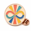 Sunburst infinity neurodivergent pin with rose gold metal outlines, cream badge base, coral teal blue and yellow enamel blocks, and a butterfly clutch on white.