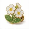White Primrose Cluster Pin soft enamel pin with raised metal outlines, flat enamel color sections, connected badge details, and a butterfly clutch on a white background.