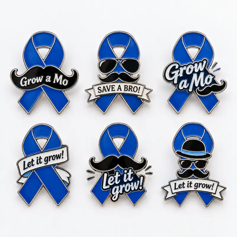 Six custom blue awareness ribbon enamel pins with black mustaches, sunglasses, hats, and slogans including “Grow a Mo,” “Save a Bro,” and “Let it grow!”